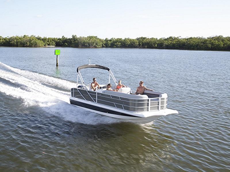 A group of people on a 2019 Hurricane FD 236 OB boat dashing through the water